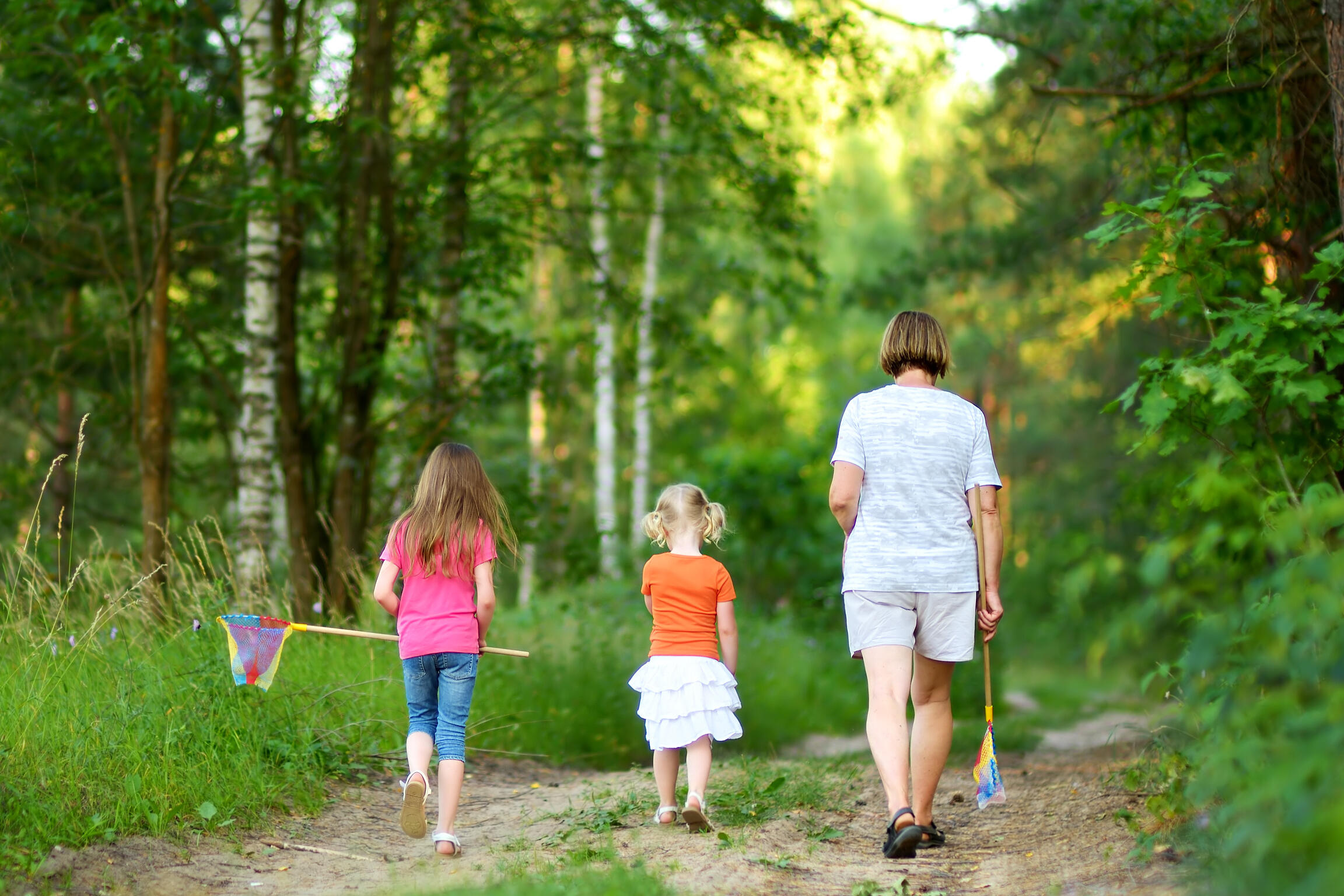 Man staring out of window A man stares out of the window contemplating how his family will be taken care of after he passes and how to make sure they are properly prepared for his end of life transition